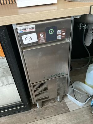 a small refrigerator that has a lot of items in it