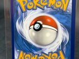 the card is in a clear plastic box with a red and white poke poke poke poke poke poke poke poke