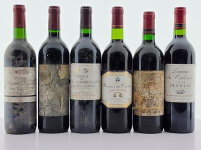 plusieurs bouteilles de vin sont alignées dans une rangée