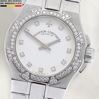 an image of a close up of a wrist watch with diamonds on it