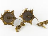 pair of antique brass and glass sconces on a white background