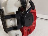 an image of a red and white blower on a white surface