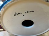 a close up of a vase with writing on it