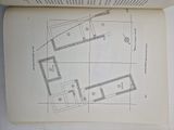 an open book with a drawing of a floor plan on top of it