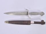 two knives that are laying next to each other on a table