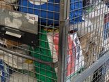 a metal cart with a bunch of items inside of it