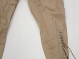an image of a pair of tan pants with laces on them