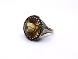 a close up of a ring on a white surface