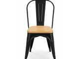 a black metal chair with a wooden seat