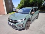 a green car parked on the side of the road