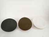 three black, white and brown rocks on a white background