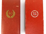 an old red book with the number twenty on it next to an old red book with the number twenty on it