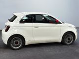 a picture of a white smart car in a showroom