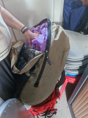 a woman that is holding a bag in her hand