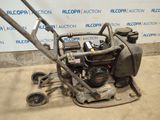 an image of a lawn mower being used by a man