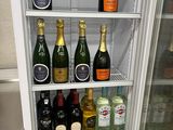 a refrigerator filled with lots of bottles of alcohol