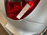 a sticker on the tail light of a car