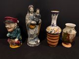 quatre vases placés les uns à côté des autres