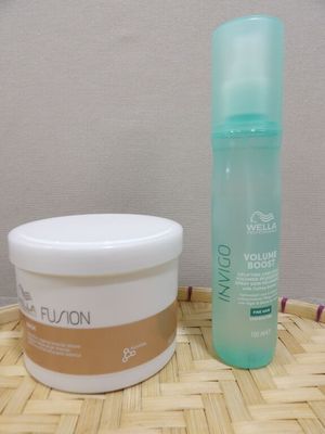 a bottle of lotion and a container of lotion sitting on a table