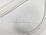 a close up of a white purse with a zipper on it