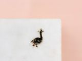 a small bird that is sitting on a marble block
