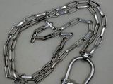 a close up of a metal chain with a shack on it