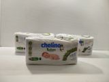 three rolls of toilet paper sitting on top of a counter