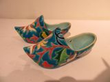 a pair of clogs that are sitting on a table