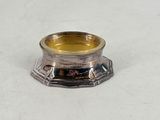 an image of a silver plated candle holder on a white surface
