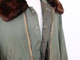 an image of a green jacket with a fur collar