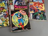 several comic books sitting on a table next to each other