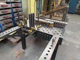 a picture of a machine that is working on a piece of metal