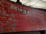 a large red machine that is sitting in a room