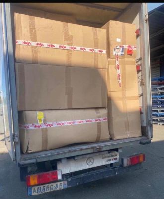 a truck that has some boxes in the back of it