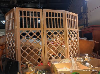 a room divider made out of wood with a lot of things in it