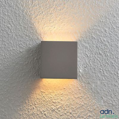 a close up of a light on a wall in a room