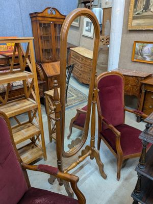 a room with a lot of furniture and a mirror on the wall