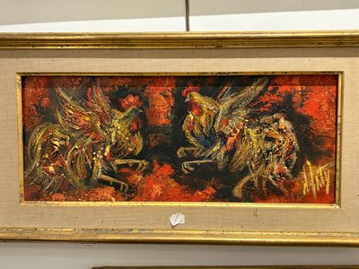 un tableau représentant deux chevaux, exposé dans un cadre doré