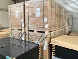several pallets of cardboard are stacked on pallets in a warehouse