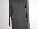 the dress is grey and has a collared neckline