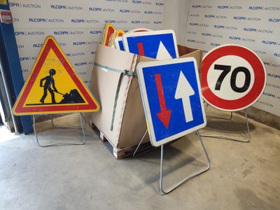 many different road signs that are on display in a room
