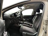 the interior of a car with the door open and the driver ' s seat down