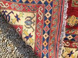 a close up of a rug laying on top of gravel
