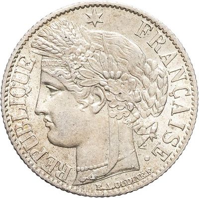 une pièce d'argent portant une tête de femme