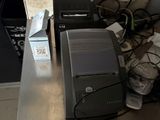 two machines sitting on the counter in the kitchen