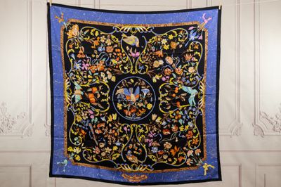 an image of a black and blue quilt hanging on a wall