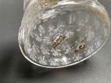 a close up of a glass of water on a table