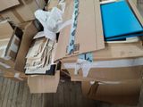 a pile of boxes and papers sitting on the floor