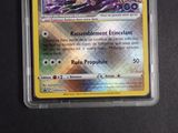a close up of a pokemon card on a table