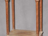 a small wooden table with a shelf on top of it